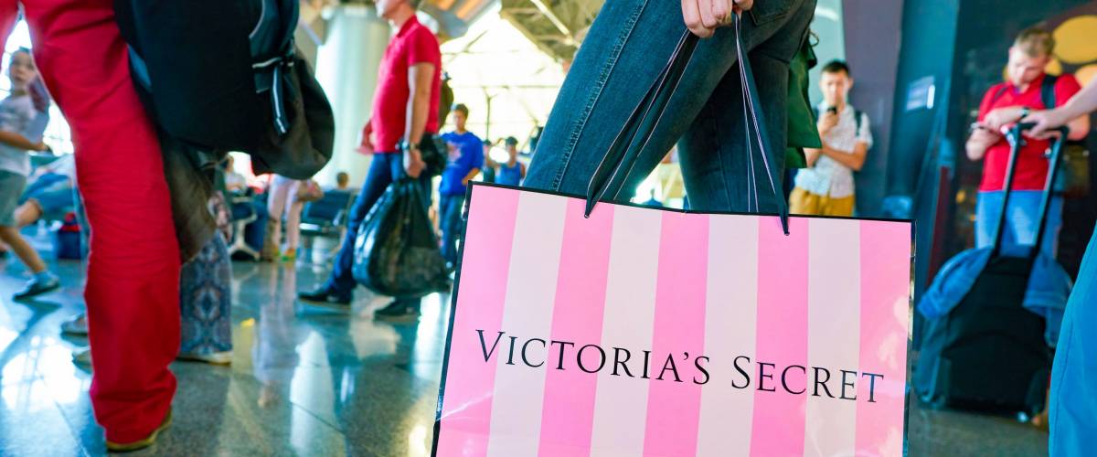 MOSCOW, RUSSIA - CIRCA AUGUST, 2018: a woman stand with Victoria's secret branded shopping bag in Vnukovo International Airport