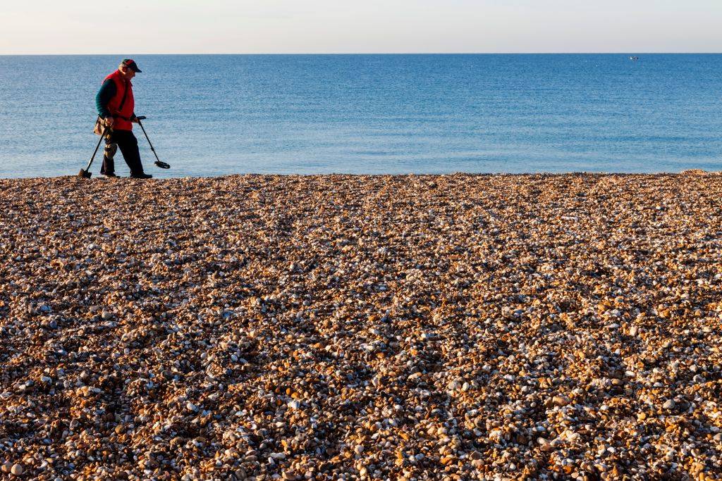 a man metal detecting